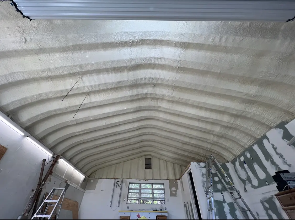 Spray polyurethane foam applied to the underside of a metal roof deck in Cornelia